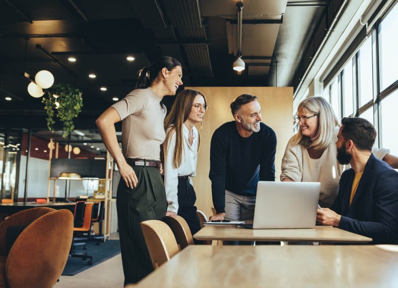 Smiling businesspeople having a discussion in an office